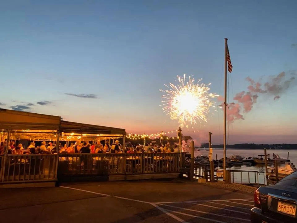 Fireworks over the packed deck at Captain Al's at sunset