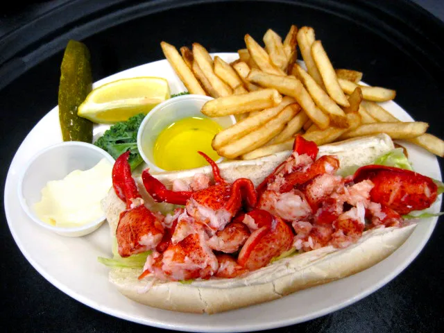 Lobster roll with drawn butter and fries
