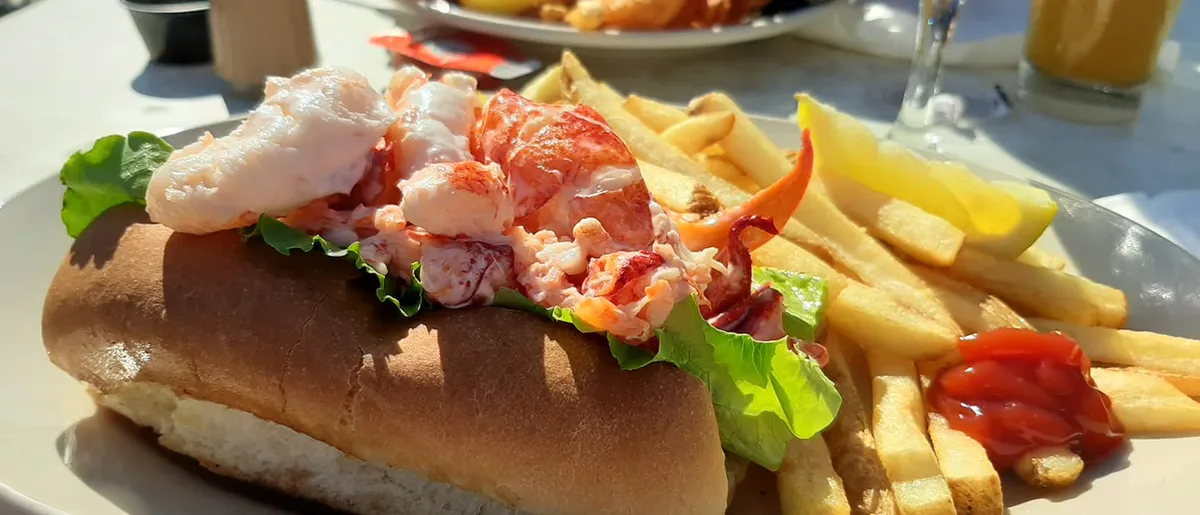 Captain Al's signature lobster roll with french fries